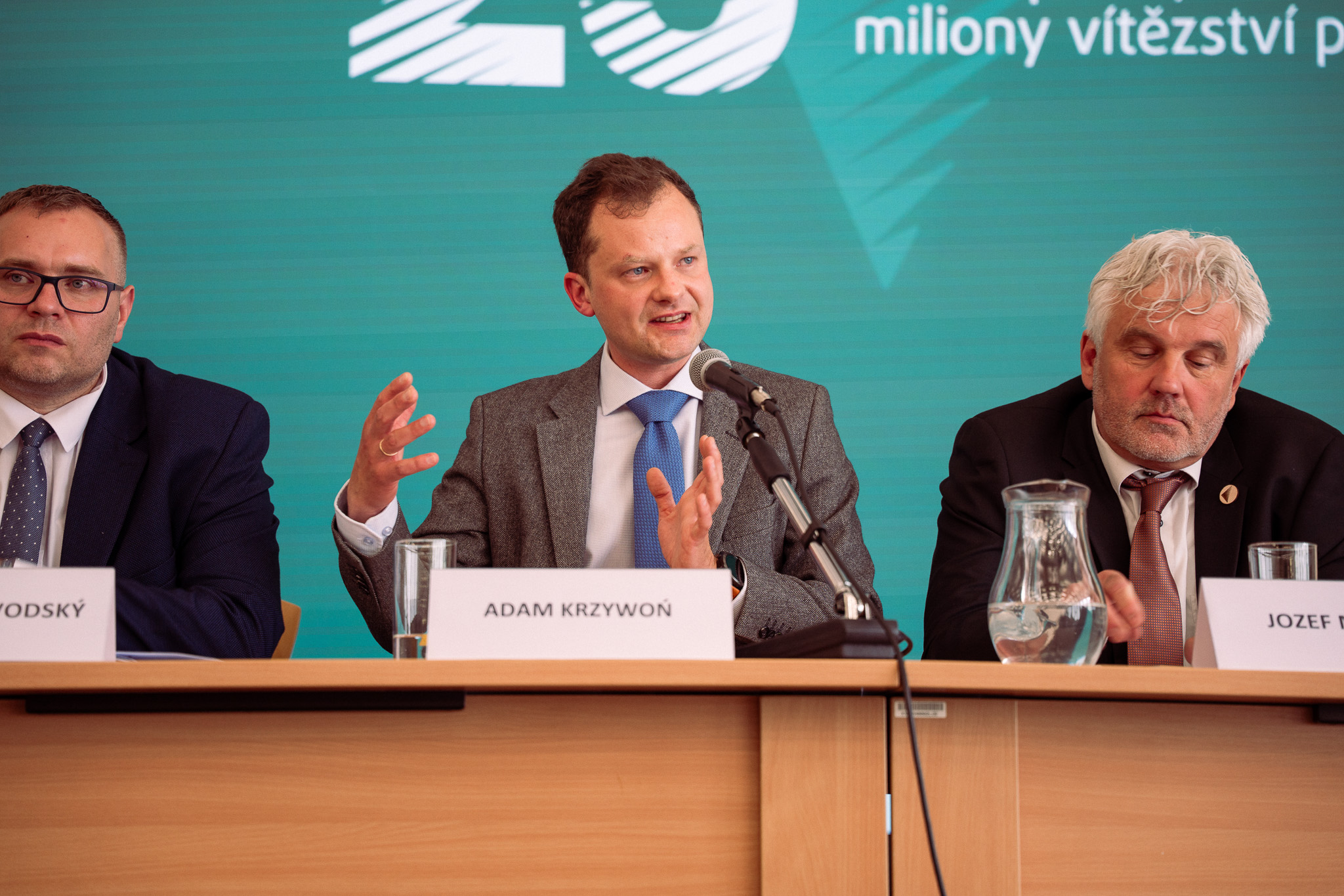 The last photo depicts Polish Deputy Commissioner for Human Rights Adam Krzywoń debating.